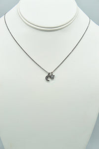 Hematite colored chain necklace w/pave CZ moon and solid star charms