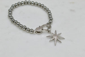 Small CZ silver starburst pendant