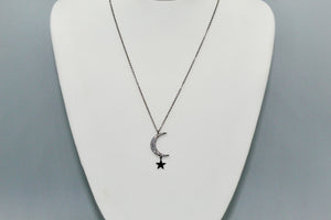 Hematite colored chain with CZ moon and hanging solid star